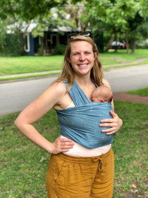 Our founder, Lauren, holds her infant daughter